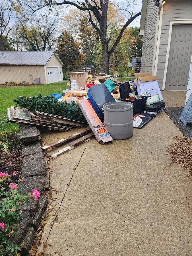 Dumpster being loaded with debris for Roofing Dumpster Rental in Bel Air